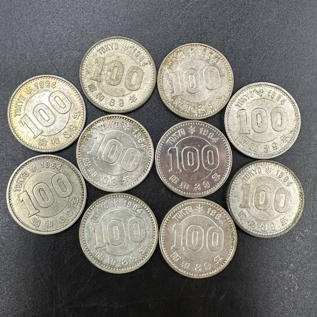 M011-611　日本古銭　１００円　１０枚　オリンピック_画像1