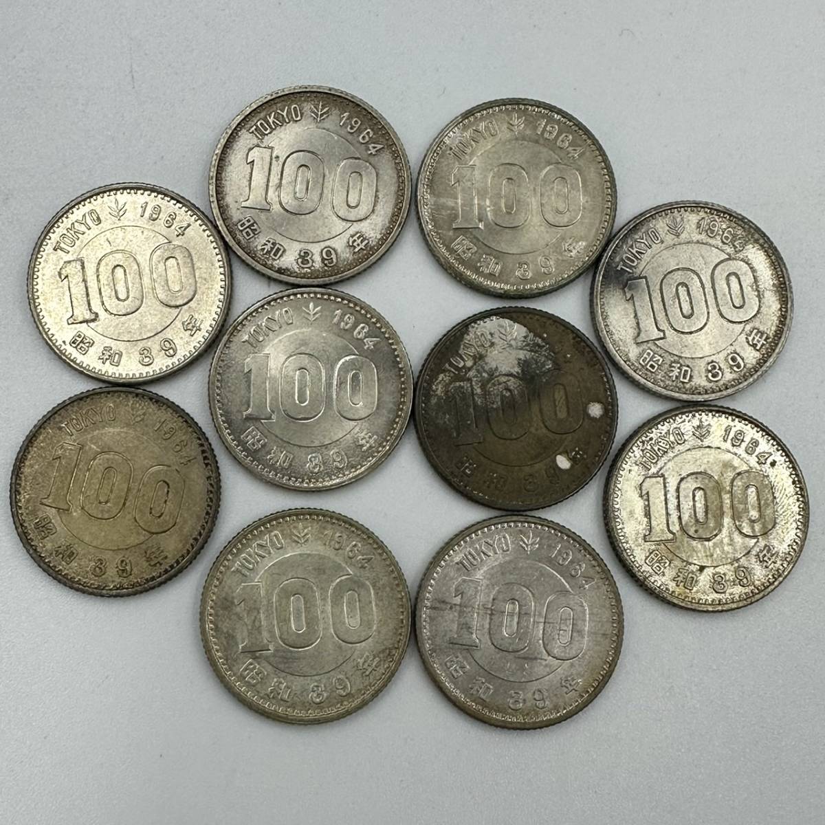 M012-528　日本古銭　１００円　１０枚　オリンピック_画像1