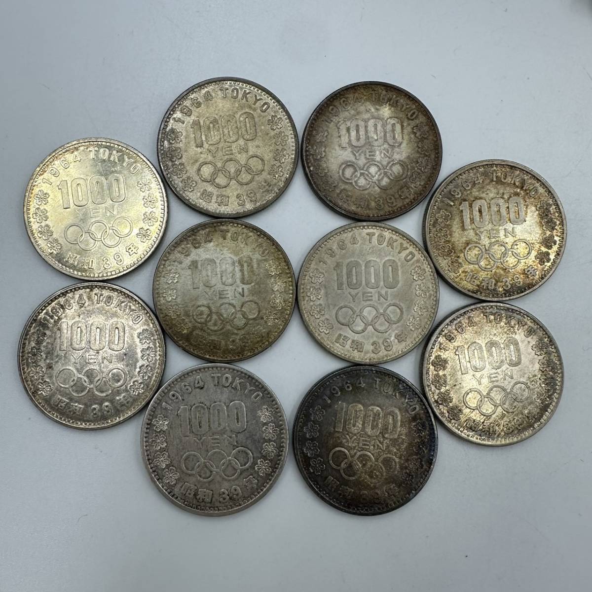 M012-560　記念硬貨　１０００円銀貨　１０枚　１９６４年　東京オリンピック　_画像1