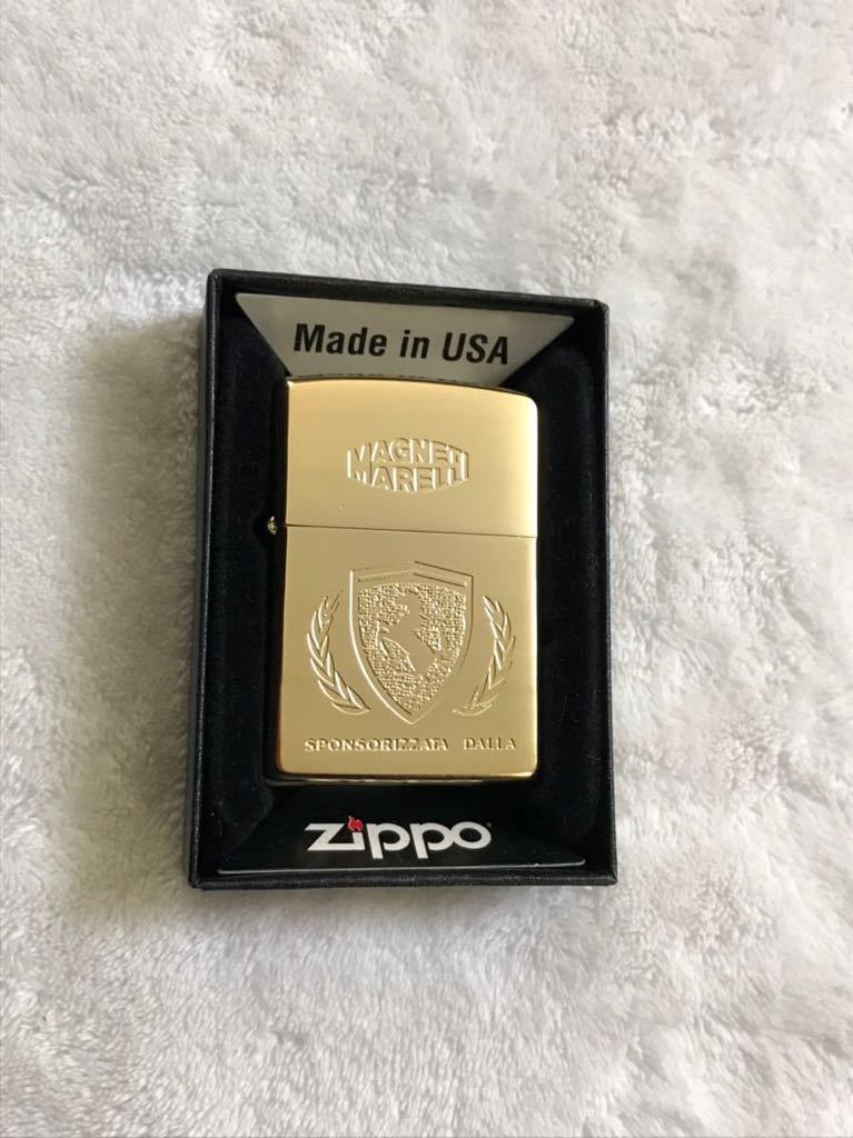 Zippo ジッポー ZIPPO オイルライター FERRARI Magneti Marelli フェラーリ マニェーティ・マレッリ 未使用品 金色 ゴールド 1993年製の画像1