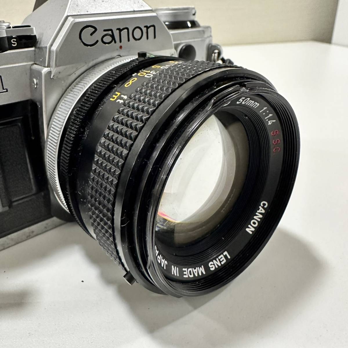 【TOA-2466】1円～ Canon AE-1 キャノン 一眼レフカメラ フィルムカメラ カメラ レンズ FD 50mm 1:1.4 動作未確認 現状保管品_画像8
