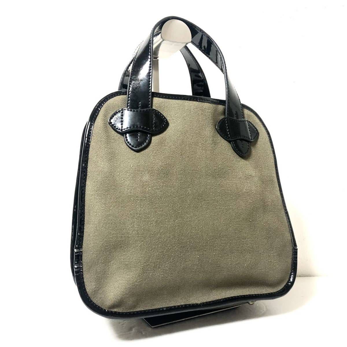 # ultimate beautiful goods #TILA MARCHtila March handbag cotton canvas × leather khaki series Gold metal fittings bottom tack 