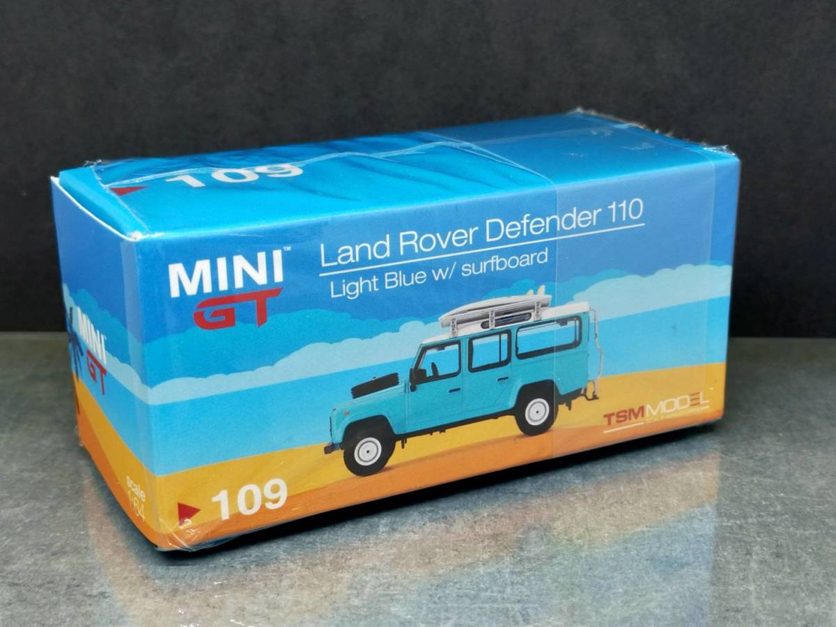 1/64 MINI GT 109 / Land Rover Defender 110 Light Blue w/surfboard / ランドローバー ディフェンダー_画像1
