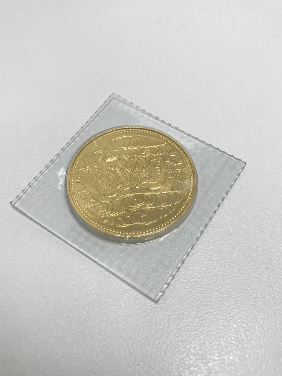 【38696】天皇陛下御在位60年記念貨幣　10万円金貨　K24　20g　大蔵省造幣局_画像1