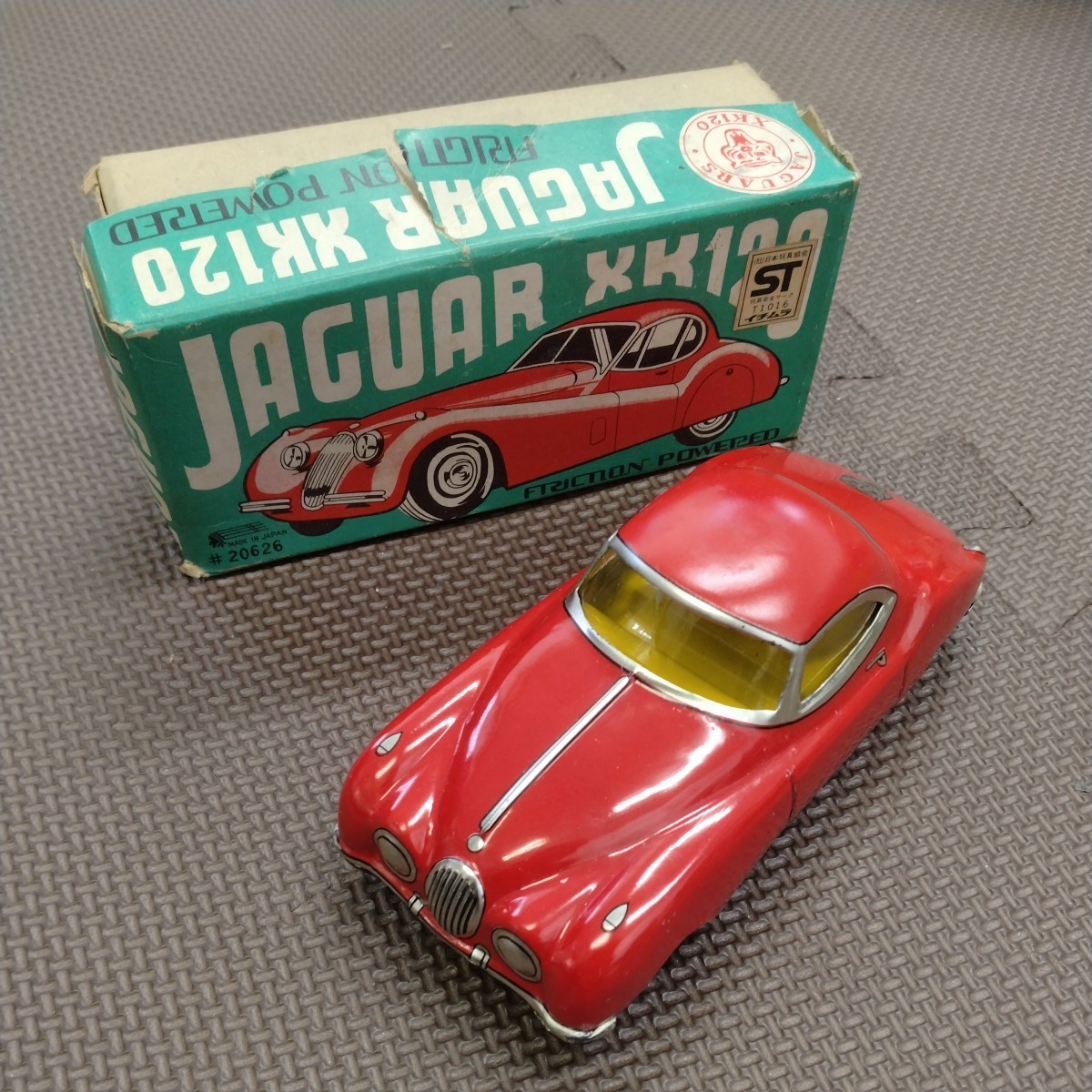 Jaguar Jaguar xk120 Friction Ichimura Showa Редкая ретро -игрушечная игрушка мини -автомобиль Троики приблизительно 14 см коробки