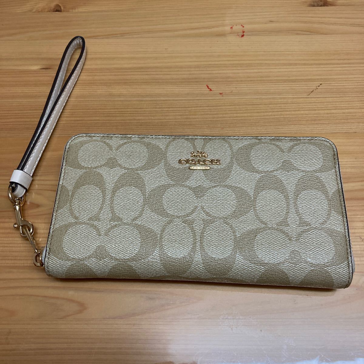 COACH 長財布　ファスナー ストラップ付き　中古　ベージュ コーチ_画像1