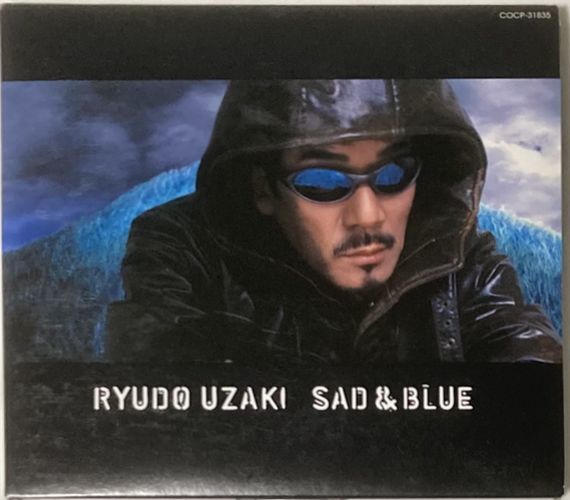 宇崎竜童/RYUDO UZAKI-SAD&BLUE/2002年歌手生活30周年を記念アルバム/セルフ・カヴァーに加え新録曲「紅蓮」追加_画像1