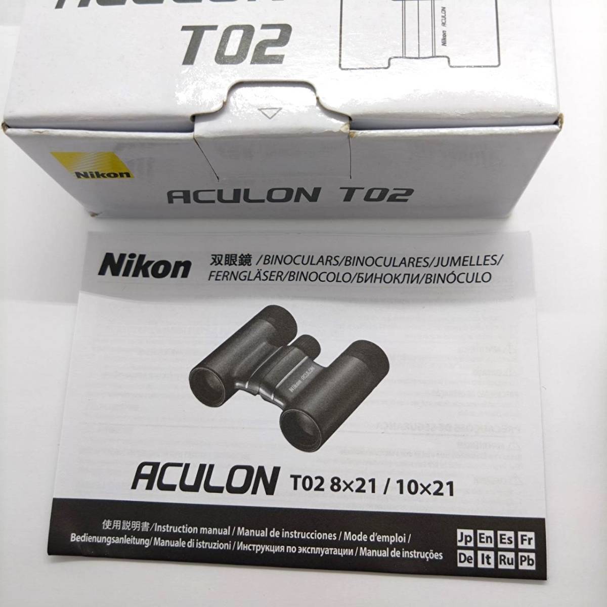  unused Nikon ACULON T02 8x21 6.3° binoculars Nikon akyu long RED outer box instructions soft case strap KA2501