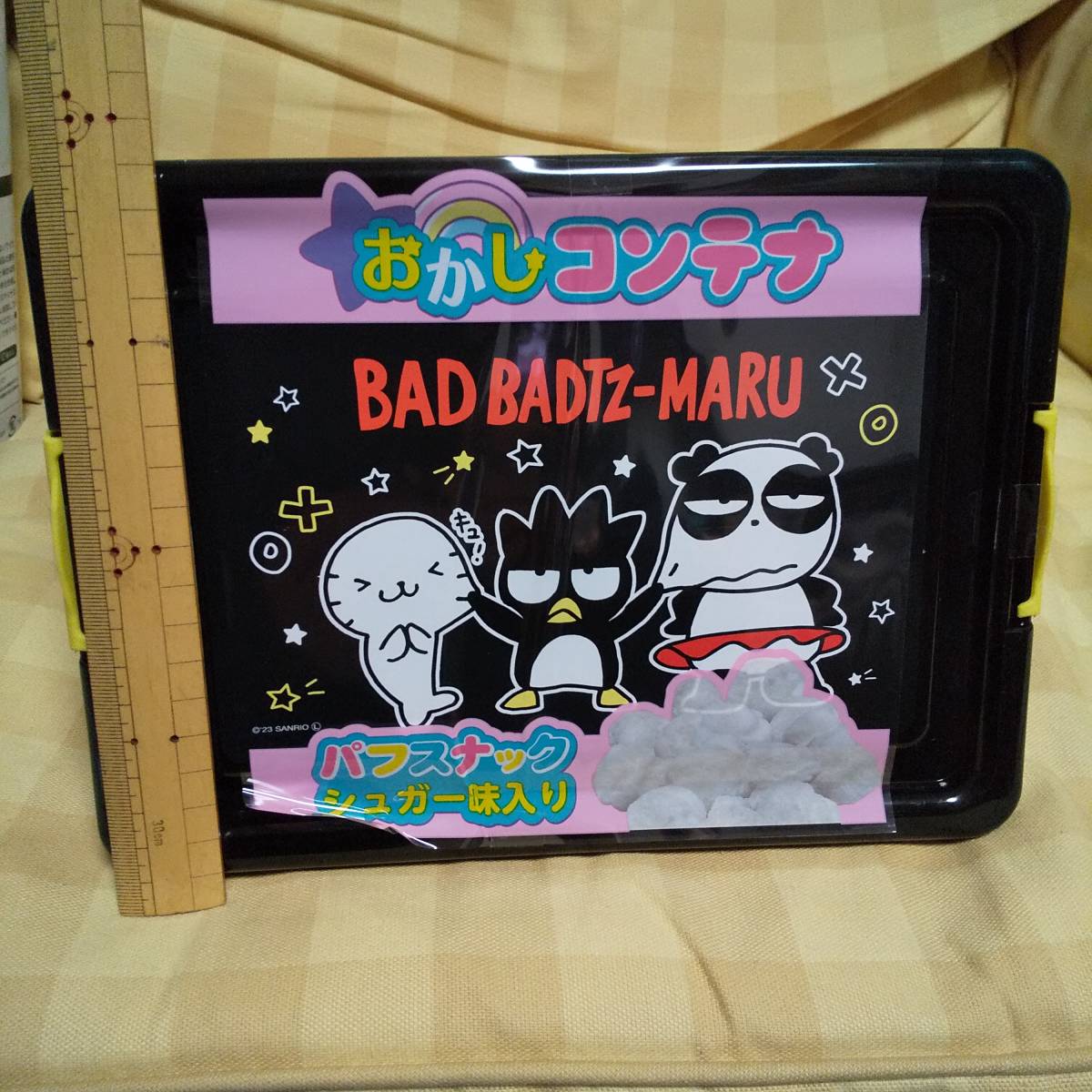 新品 未開封 サンリオキャラクターズ バッドばつ丸 お菓子コンテナ パフスナック入り 賞味期限2024.04.25　小物入れ 送料510円～_画像1
