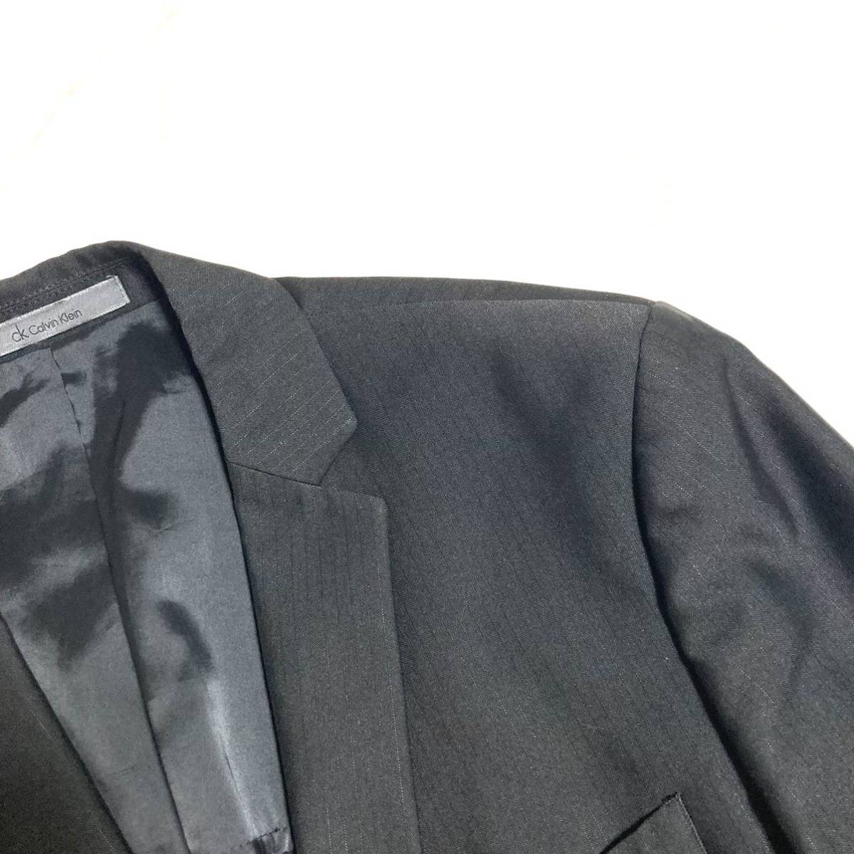 美品 CK カルバンクライン 圧巻の光沢 セットアップ スーツ シングル 2Bビジネス 婚礼 セレモニー ブラックスーツ L_画像4