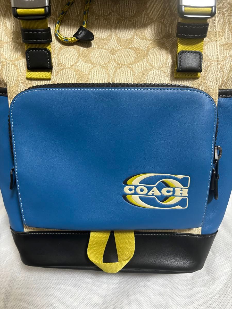 COACH トラック バックパック・カラーブロック シグネチャー キャンバス・コーチ スタンプ