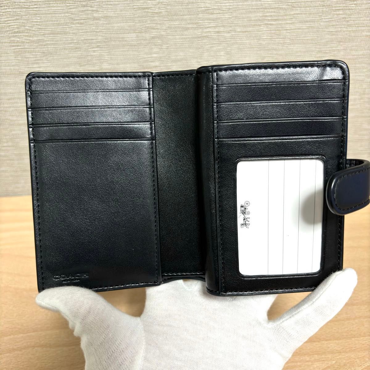 【新品未使用】 COACH コーチ シグネチャー エンボス レザー 二つ折り財布 ブラック