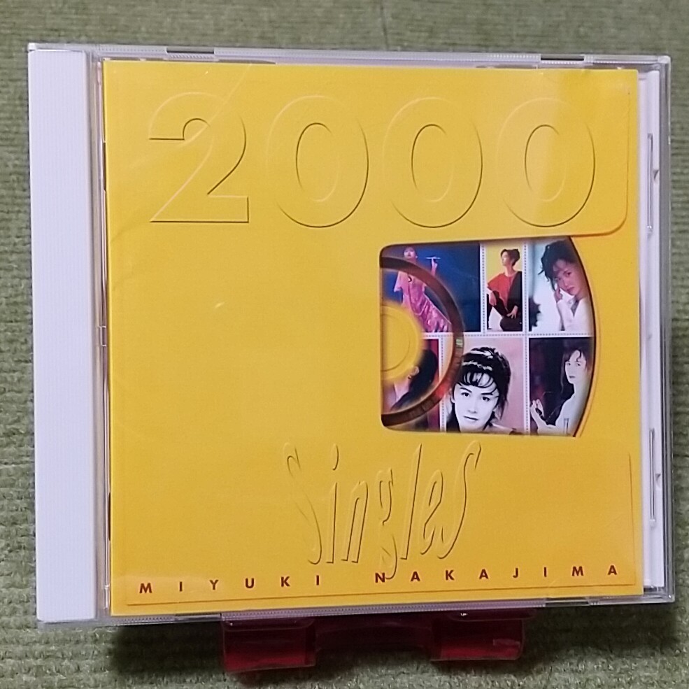 【名盤！】中島みゆき Singles2000 地上の星 瞬きもせず 命の別名 糸 たかが愛 旅人のうた 空と君とのあいだに ファイト！ ベスト best_画像2