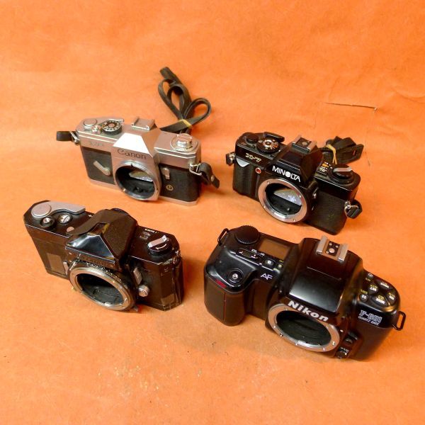 a054 フィルムカメラ ジャンク 4点 MINOLTA X-7/Nikon F-601/Canon FP/Nikomat/80の画像1