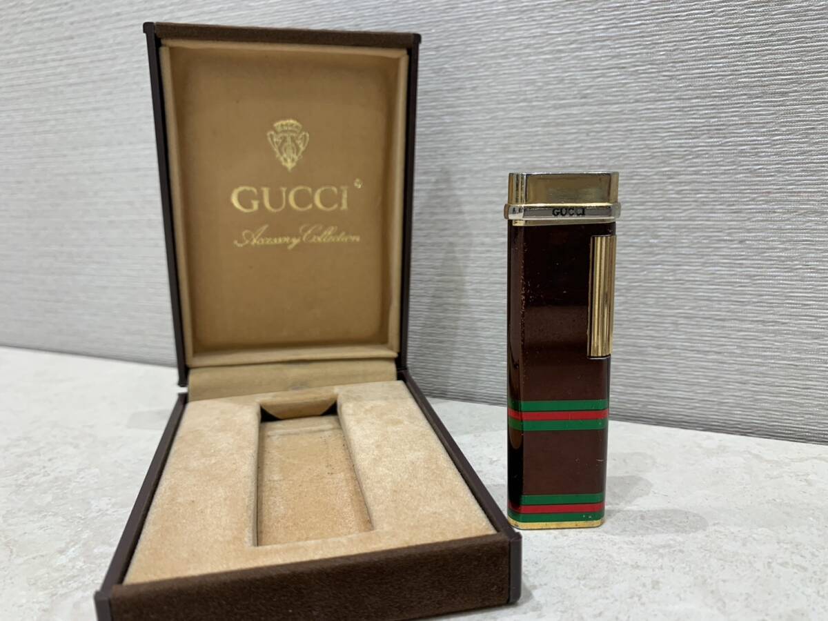 M3306　GUCCI グッチ シェリーライン ガスライター 喫煙具 ゴールド×ブラウン 　ローラ式　箱有　火花散ります！_画像1