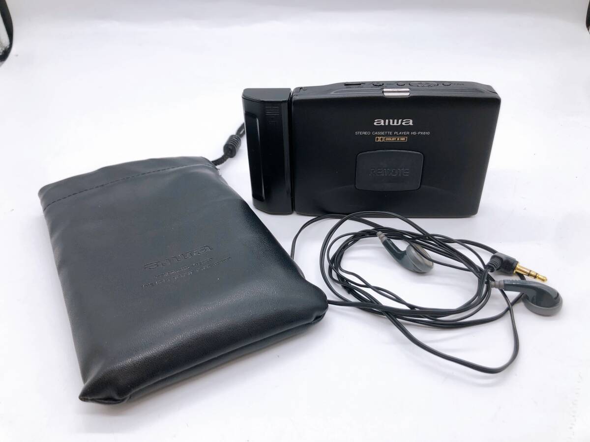 【17590】AIWA アイワ カセットプレーヤー HS-PX610 ブラック サイズ 140×80×20 充電池 ソフトケース イヤホン 付 約180ｇ 動作確認済み _画像1