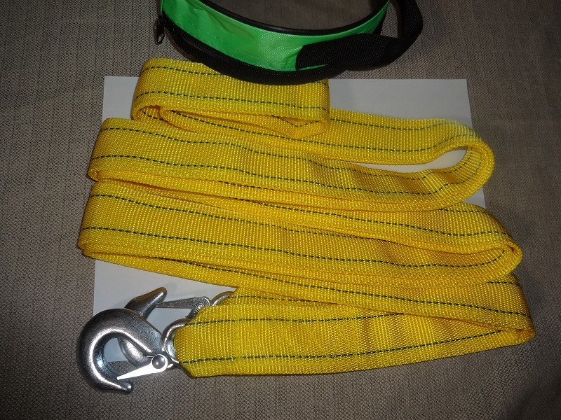  case attaching 4m traction rope enduring . weight 5t nylon sling belt both edge hook attaching yellow color 