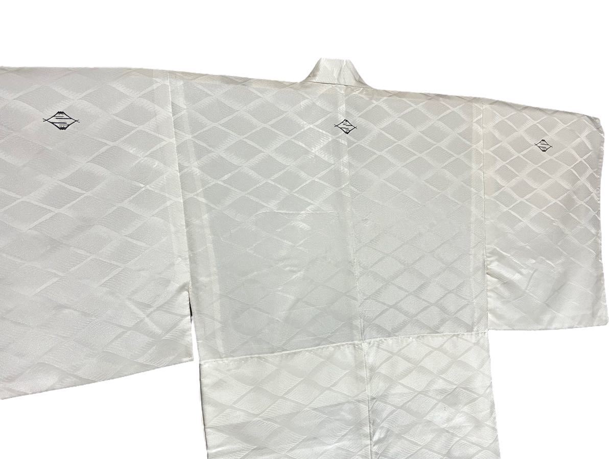  man long kimono-like garment white house . retro kimono peace pattern Vintage stylish 