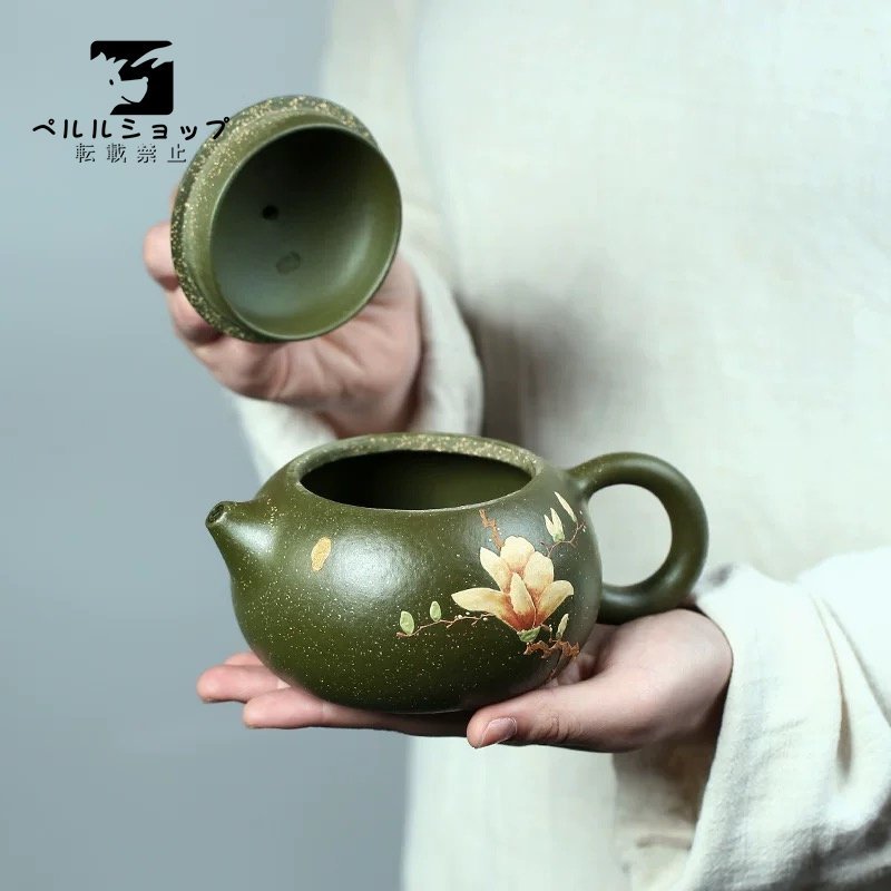 紫砂陶器の緑の急須 玉蘭柄のティーポット 粒の質感 レリーフの 紫砂陶器の緑の急須 玉蘭柄のティーポット 粒の質感 レリーフの