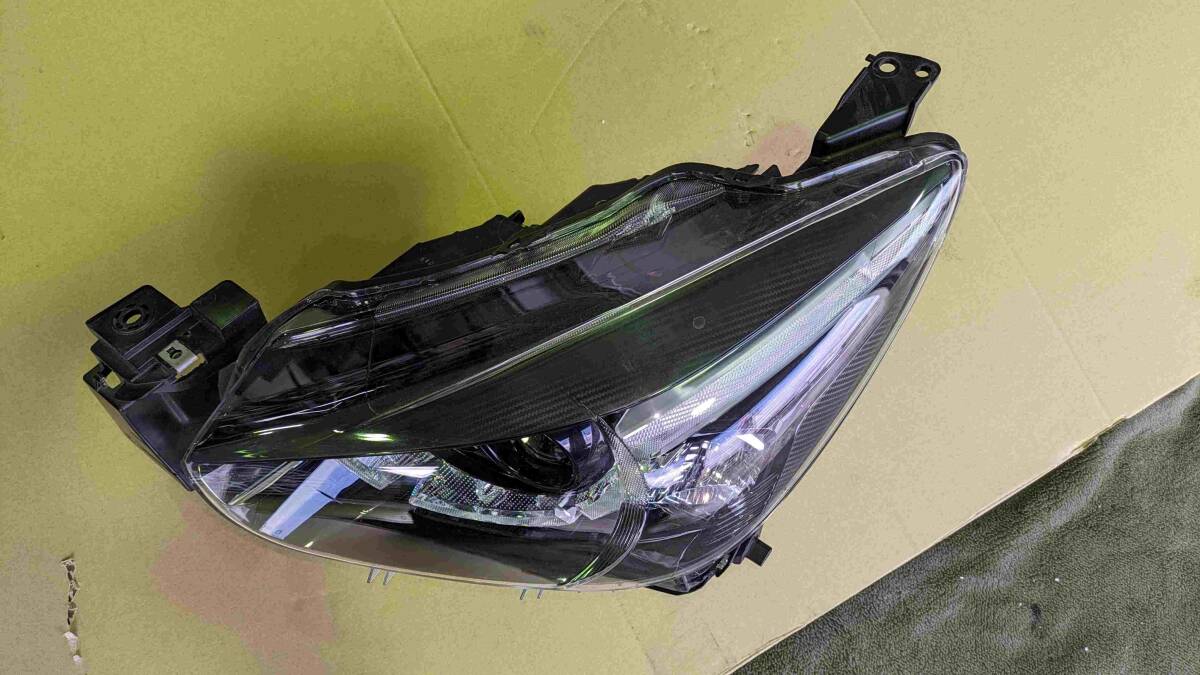  Mazda Demio left head light 