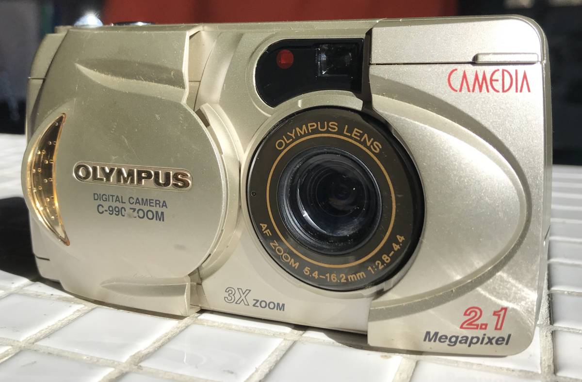 OLYMPUS CAMEDIA C-990ZOOM 5.4-16.2mm f2.8-4.4 Olympus ka media Junk digital camera navy blue teji digital camera 