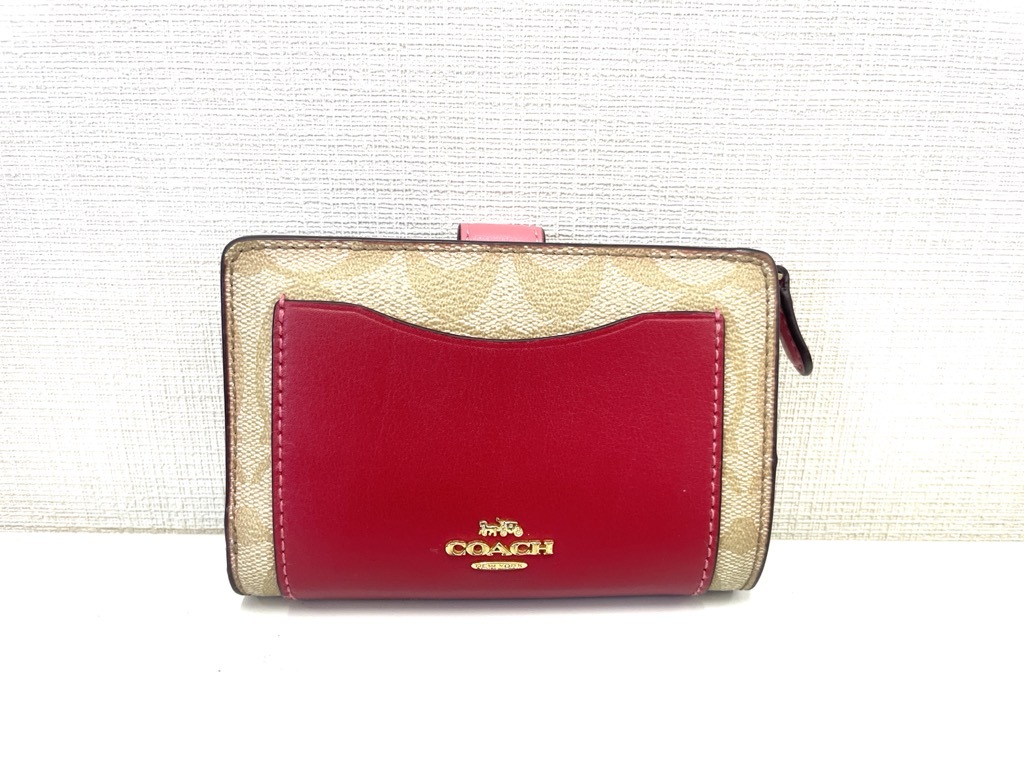 4559★COACH 二つ折り財布◇中古品 シグネチャー柄 赤 ピンク◇ブランド小物 コーチ レディース 女性用 大容量_画像1