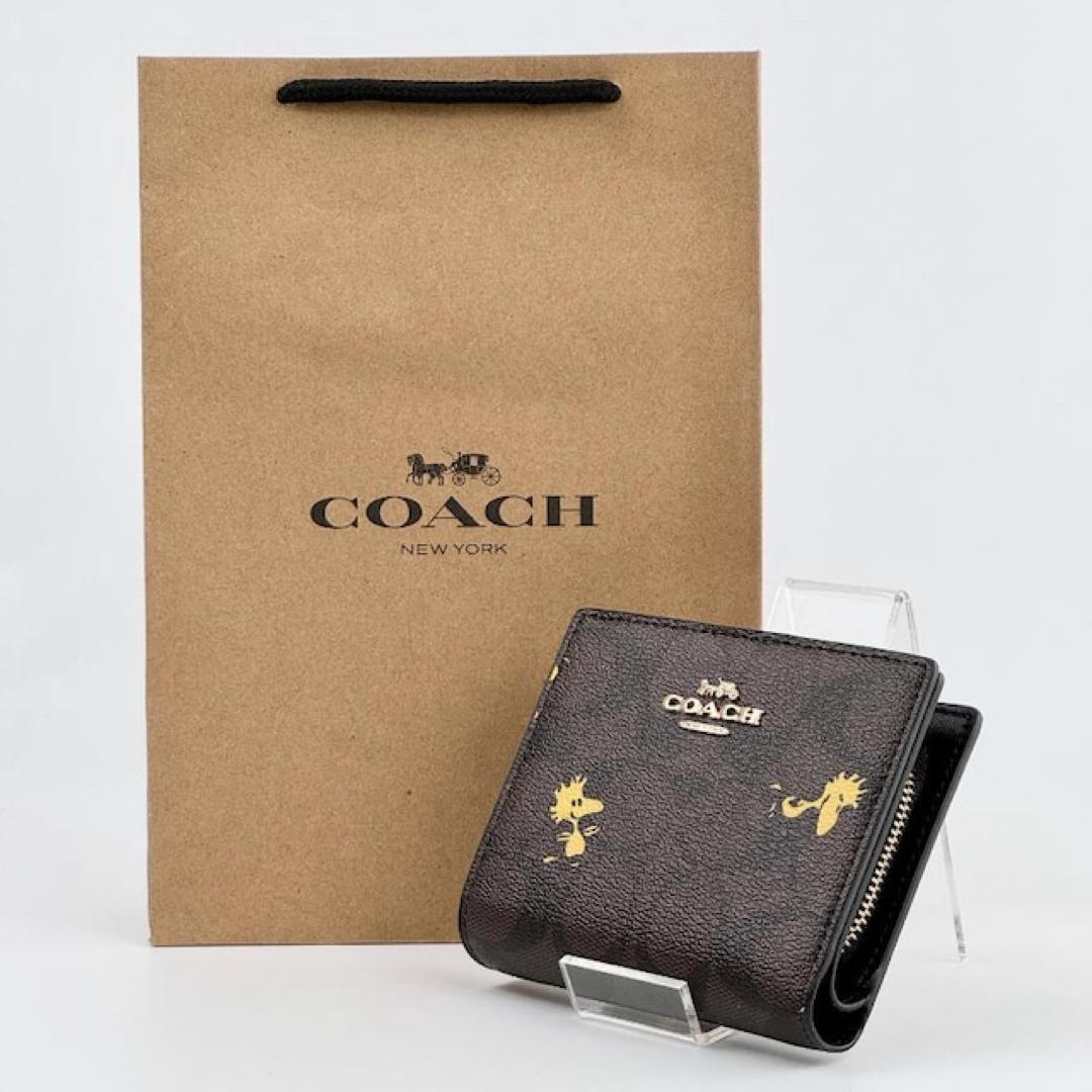 新品 COACH コーチ スナップウォレット COACH×PEANUTS レザー 折財布 コラボ商品 ウッドストック柄 シグネチャー