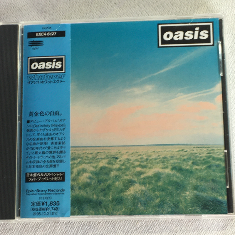 Oasis「Whatever」＊通算5枚目のシングル「ホワット・エヴァー」に「シガレッツ&アルコール」を追加収録した日本編集によるミニ・アルバムの画像1