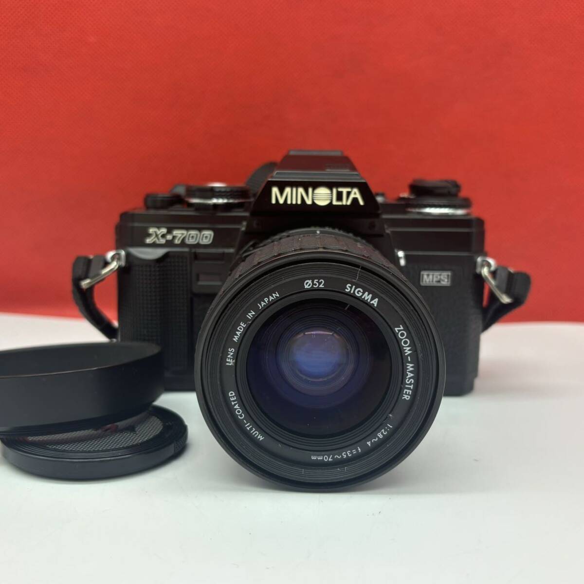 ◆ MINOLTA X-700 フィルムカメラ 一眼レフカメラ ボディ SIGMA ZOOM-MASTER F2.8〜4 35〜70mm レンズ シャッター、露出計OK ミノルタ_画像1