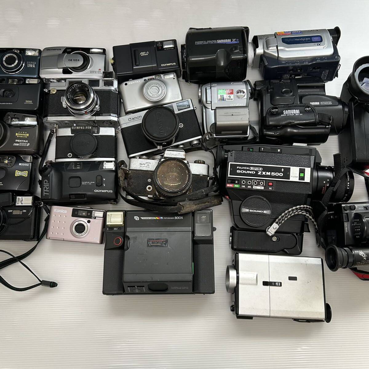 1 jpy ~ film camera video camera summarize PENTAX FUJI RICOH FUJICA KONICA OLYMPUS Canon MINOLTA SAMURAI etc. ( junk operation not yet verification KJ )