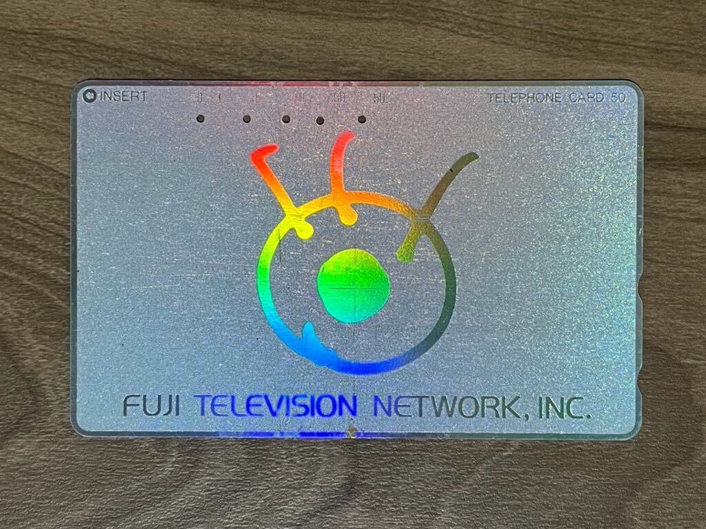  used Fuji tv original telephone card see angle according to light . person . changes 