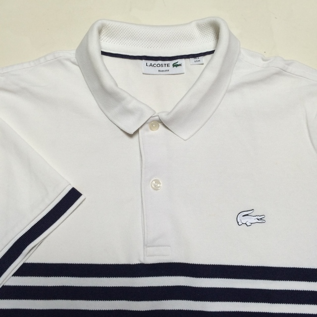 美品 LACOSTE ラコステ 半袖ポロシャツ サイズ４ 白色 無地 鹿の子生地 濃紺のボーダー柄 サイドスリット SLIM FIT ラコステジャパン の画像1