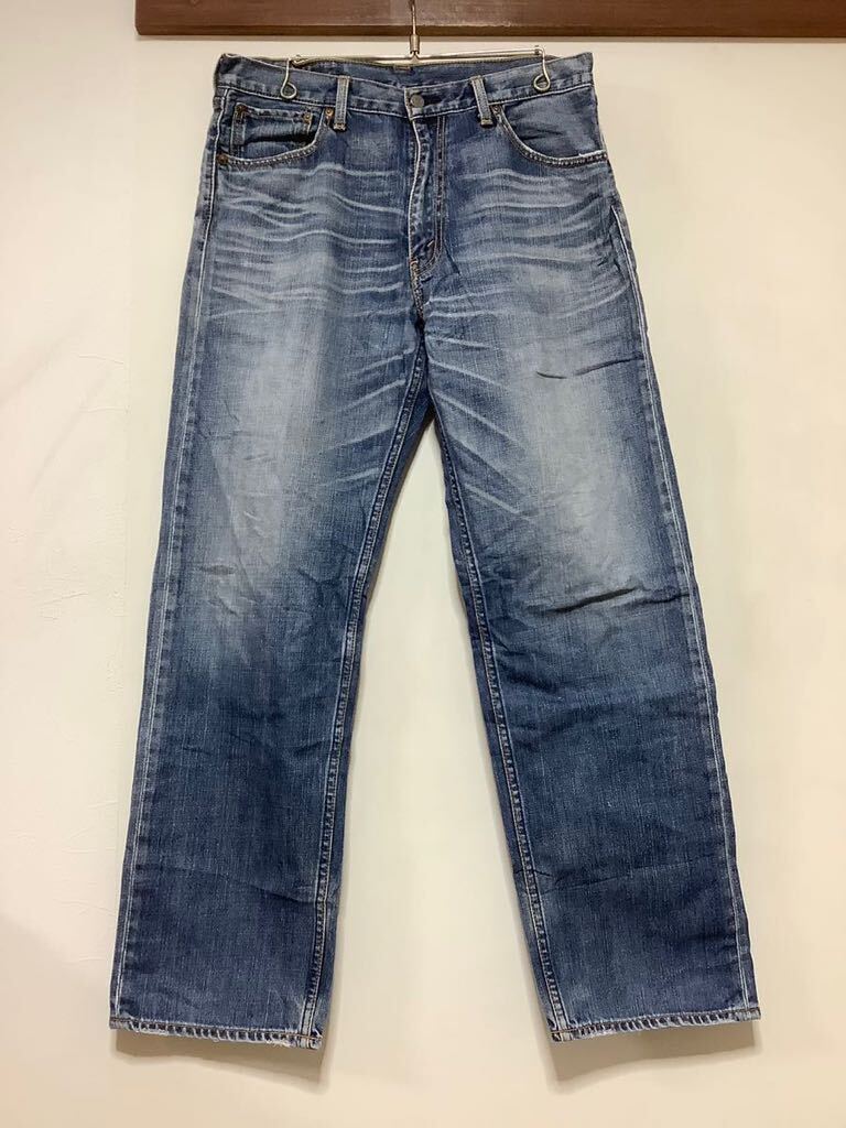 E-1297 Levi's リーバイス 703 デニムパンツ W34 ユーズド加工 ジーンズ ジーパン_画像1