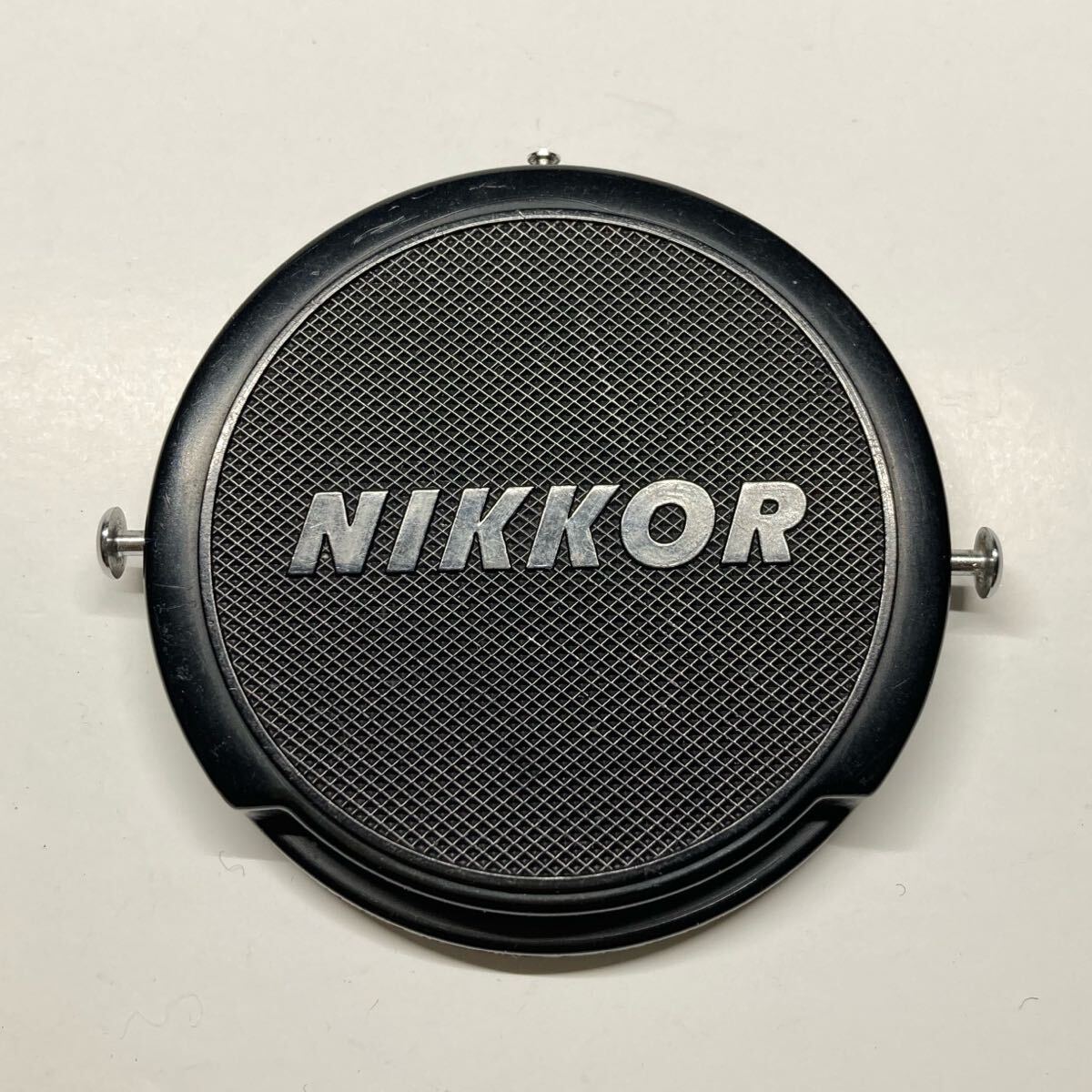 【送料無料】ニコン Nikon NIKKOR 52mm ピンタイプレンズキャップ の画像1