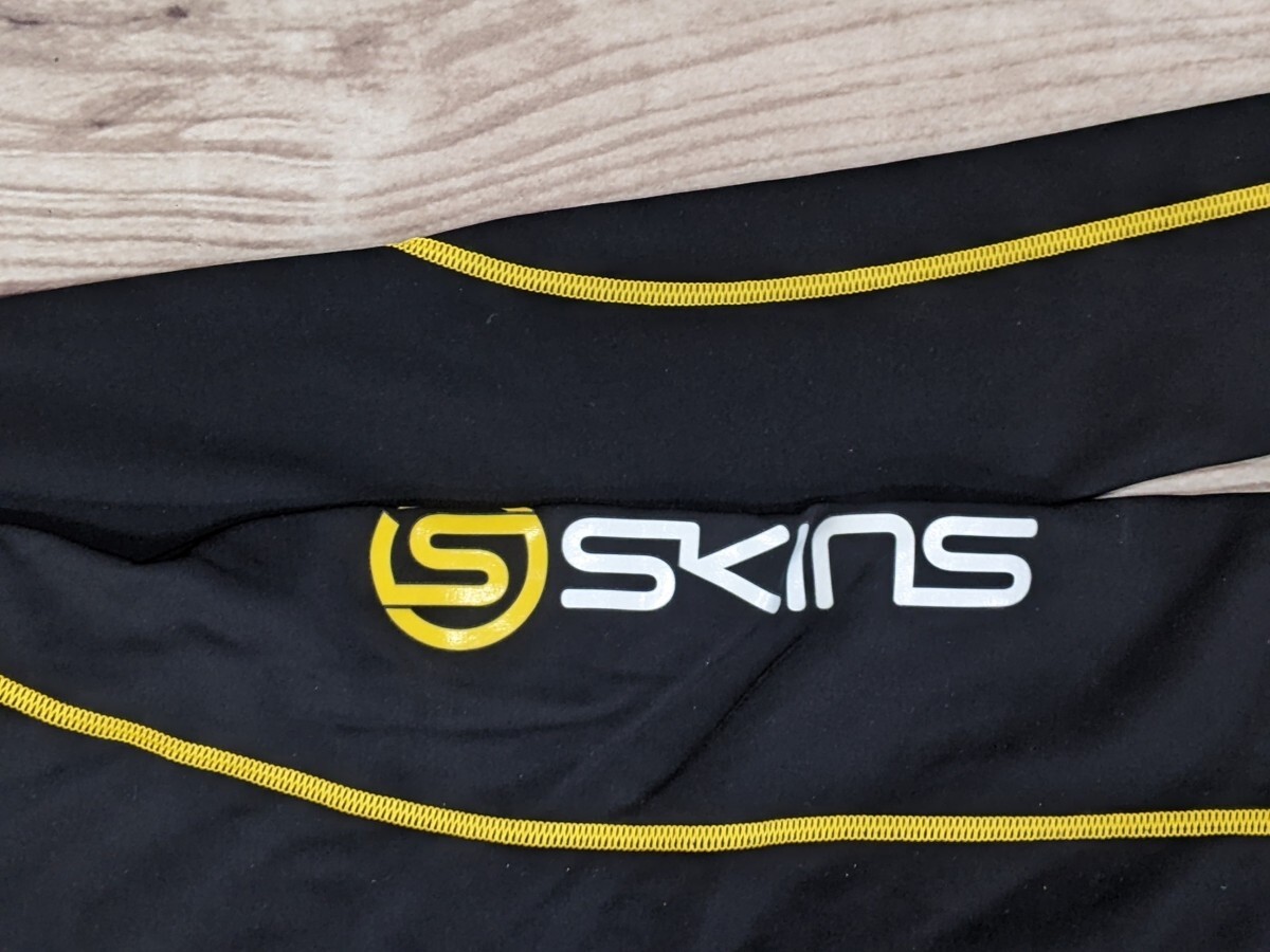 18．SKINS スキンズ ハーフジップ 速乾ジャージ ハーフジップ ブルゾン レディースXL　黒黄色トレーニングウェアx304_画像3