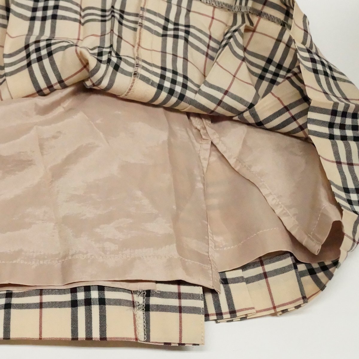 中古 バーバリー BURBERRY LONDON ノバチェック 巻きプリーツスカート 120A 毛100％ 薄手 裏地付き 数か所汚れあり_画像7