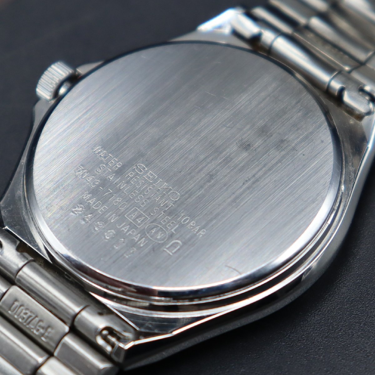 SEIKO SPIRIT セイコー スピリット 7N43-7180 クォーツ シルバーカラー文字盤 日/英デイデイト 純正ブレス メンズ腕時計_画像7