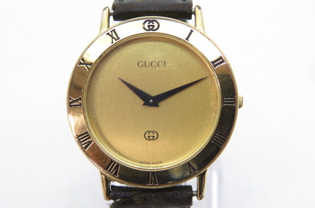 1円～【電池切れ】GUCCI グッチ　3000M　メンズ　クオーツ　腕時計　ゴールドケース　ブラックレザーベルト　3-4-8_画像1