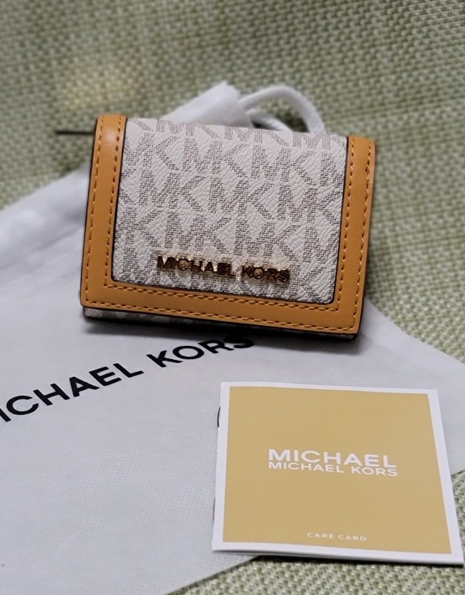 新品MICHAEL KORS 財布JET SET TRAVELトライフォールド ジップウ ォレットエクストラスモールMKシグネチャ