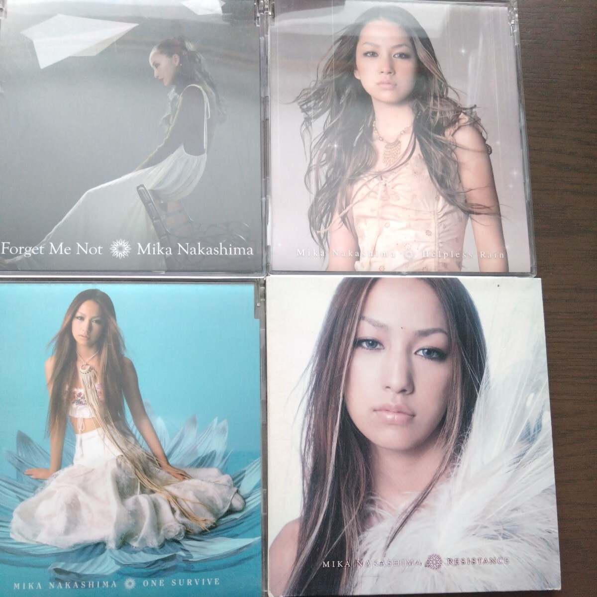 送料込み 中島美嘉 「RESISTANCE」「ONE SURVIVE」「Helpless Rain」「Forget Me Not」4枚セット_画像1