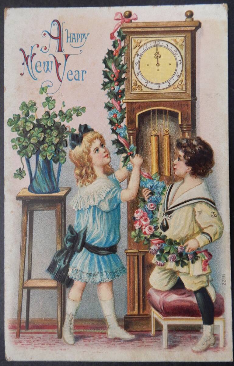 アンティーク ポストカード 少年 少女 時計 ／ エンボス加工 A HAPPY New Yearの画像1