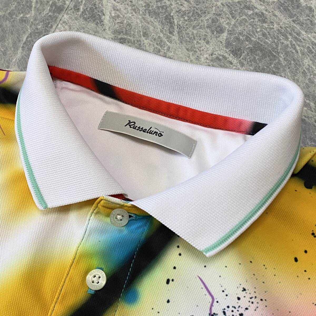 極美品 Russeluno ラッセルノ 半袖 ポロシャツ トップス ストレッチ 吸汗速乾 メンズ 5 (L) 総柄 スマイル ワッペン ゴルフウェア C356の画像5