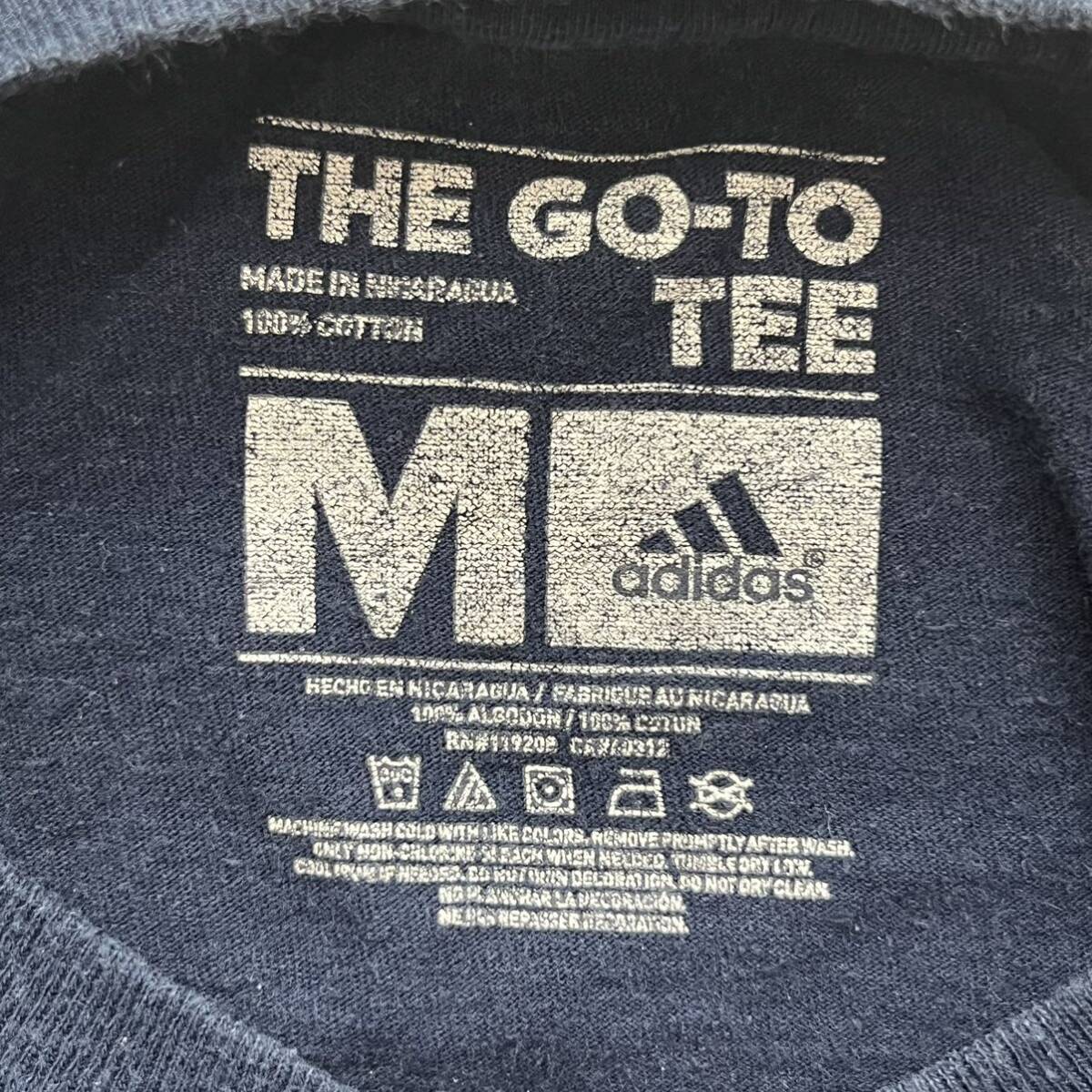 アディダス adidas 半袖Tシャツ NBA プリント Cares 古着 Mサイズ 送料込 ロゴ ネイビー 紺色 綿 コットン