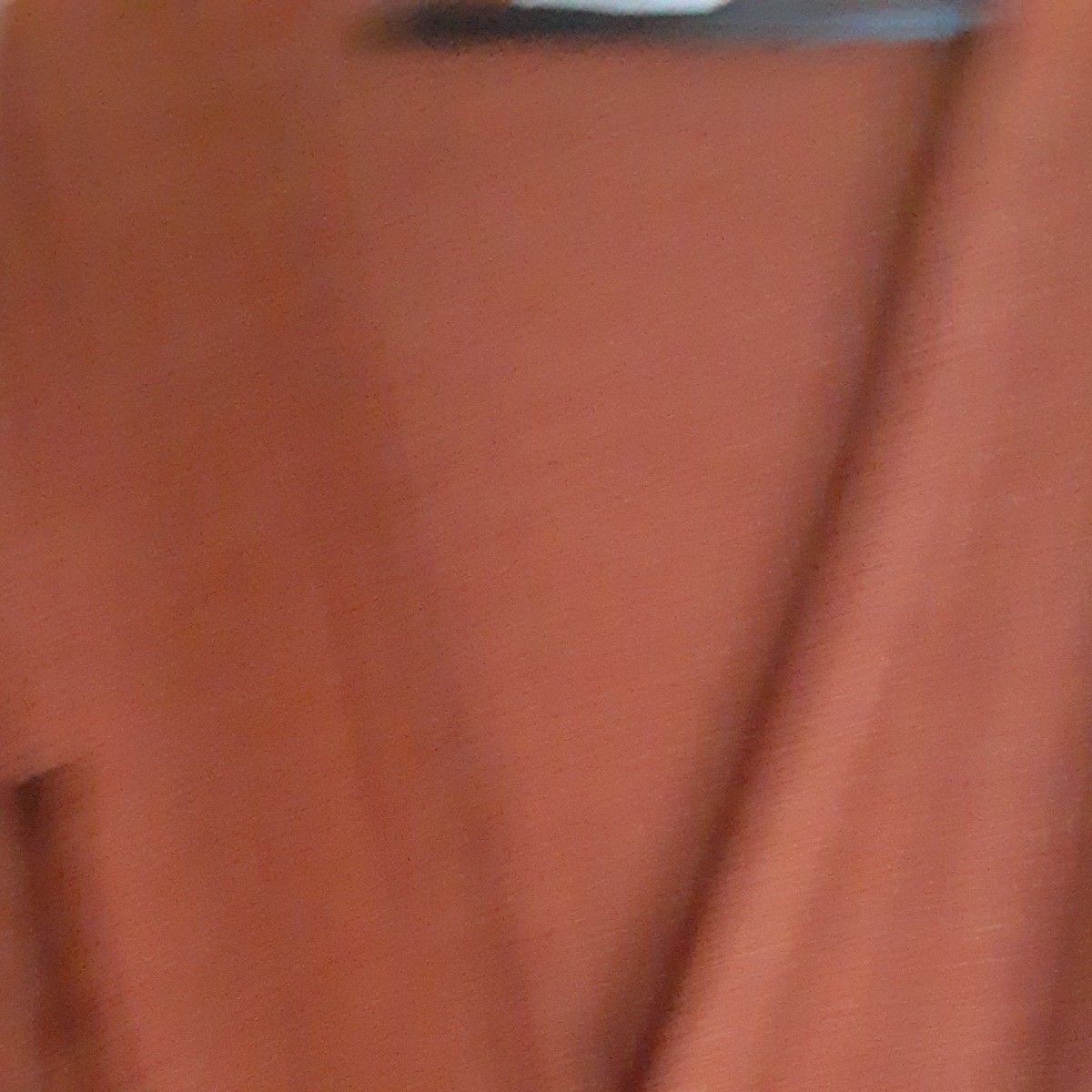 オレンジ色の 長袖 ロングカーディガン