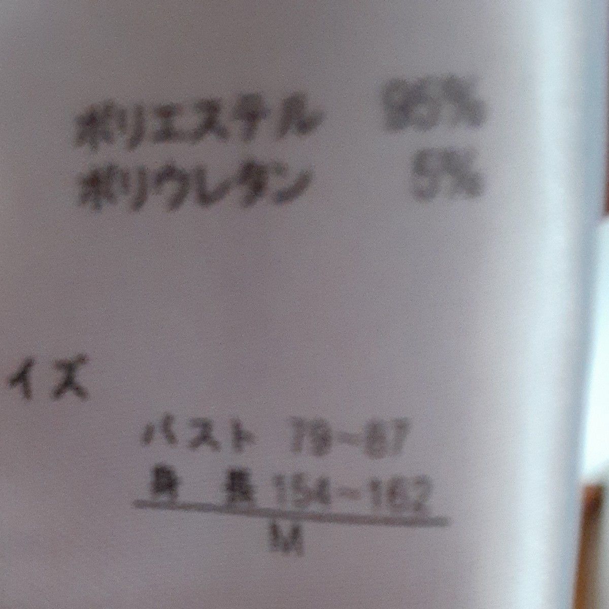 オレンジ色の 長袖 ロングカーディガン