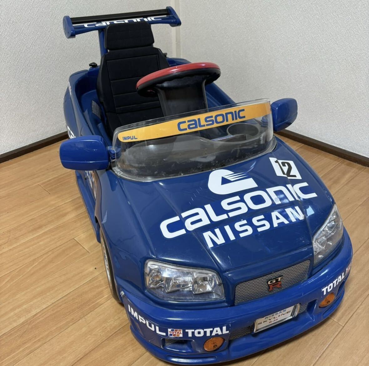 子供向け電動乗用カー ミズタニ A-KIDS CALSONIC SKYLINE GT-RR-34カルソニックスカイライン NISSAN ジャンク 現状品の画像1