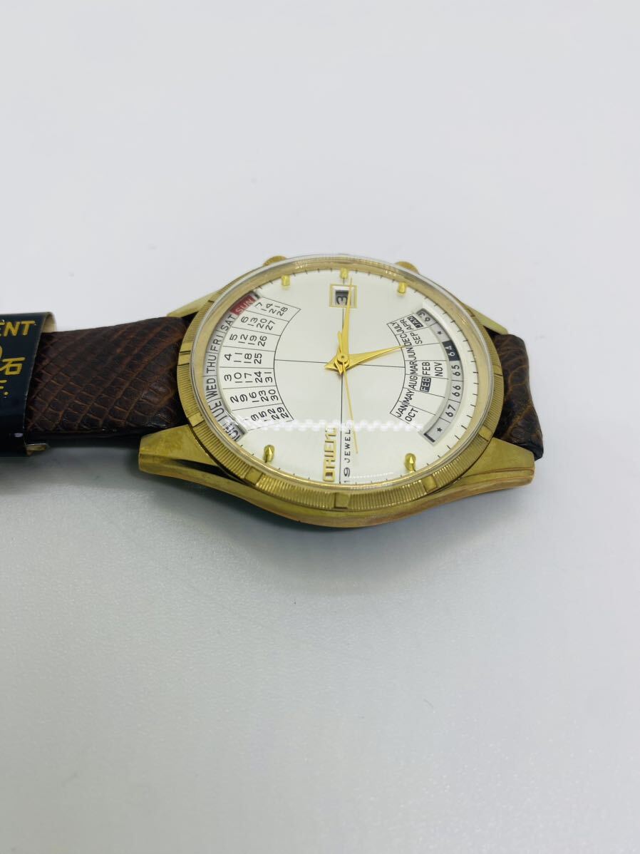 希少　ORIENTオリエント 手巻き　万年カレンダー 19石 シルバー文字盤 ゴールドカラー　メンズ腕時計 デッドストック　動作品　(21)_画像3