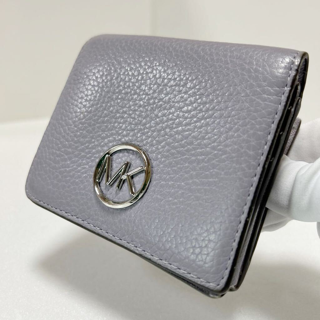 ◆MICHAEL KORS マイケルコース◆ 二つ折り財布　コンパクト　本革　小銭入れ＆定期入れ有　ライトパープル 【USED】0313