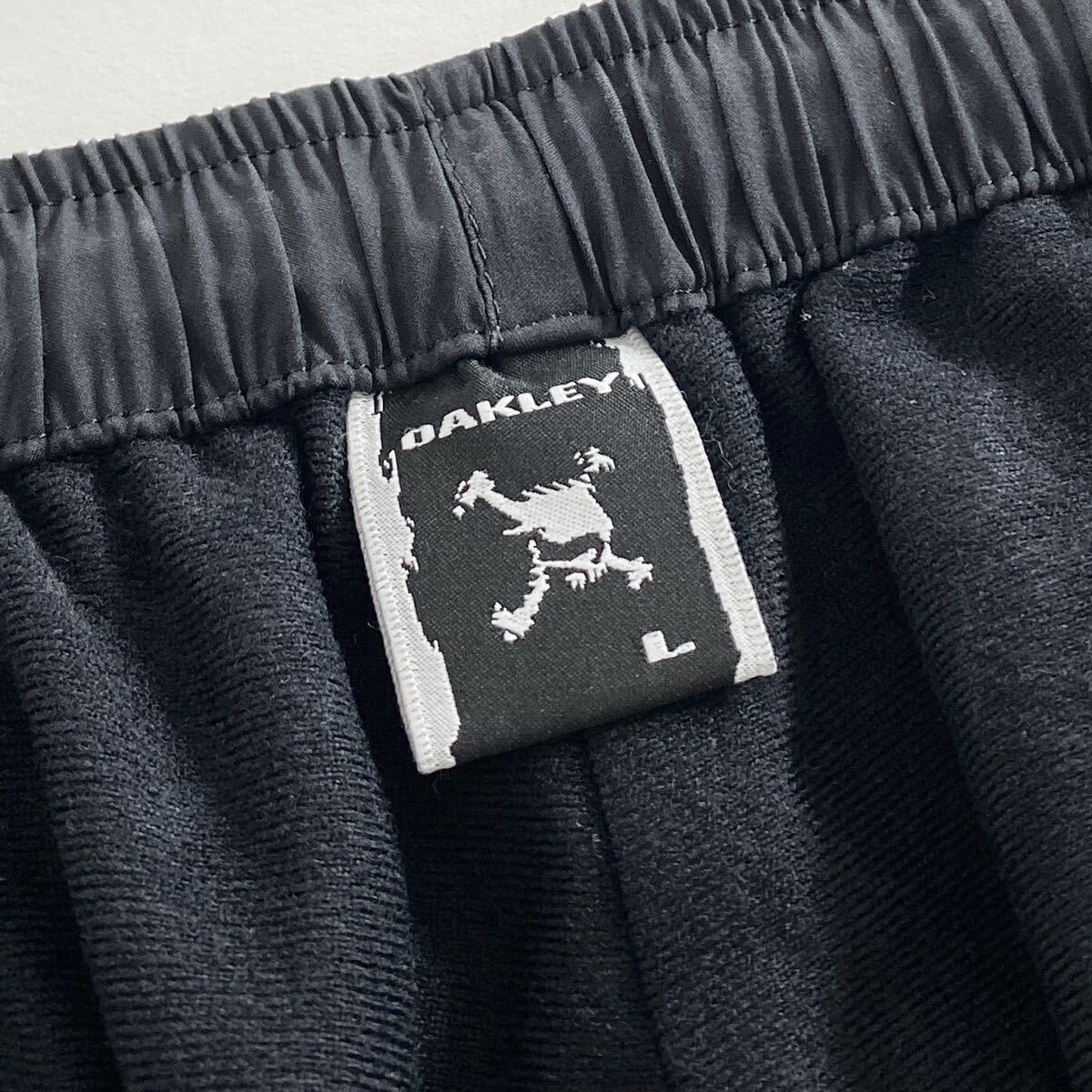 Ac29 OAKLEY オークリー ロングパンツ サイズL ブラック メンズ スポーツウェア 裾ドローコード ジップアップ ロゴ 刺繍 ボトムス_画像8