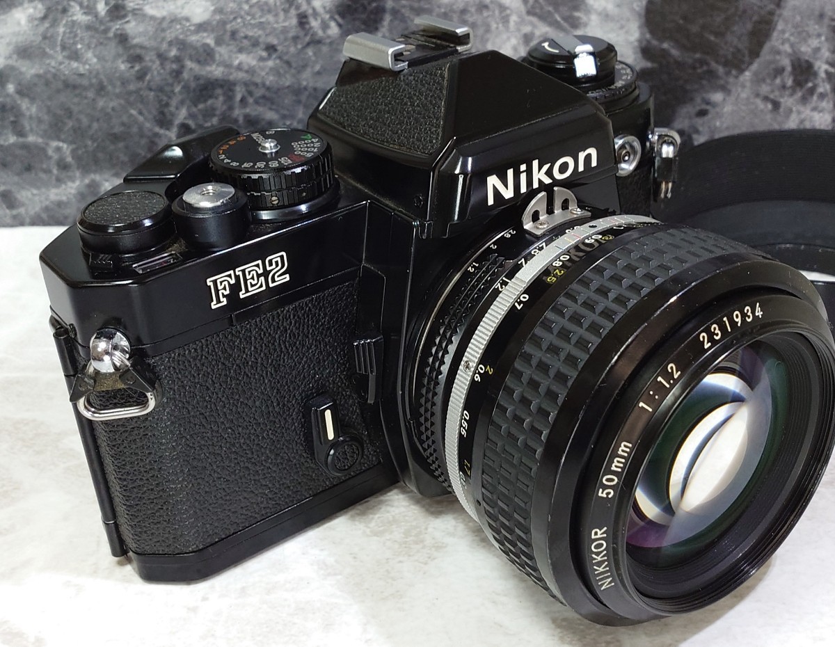 【終活コレクション整理】 Nikon FE2黒＋Ai NIKKOR 50mm f1.2 シンデレラ単焦点 純正メタルフード付 各動作良好 露出計メーターOK 光学美品_画像2